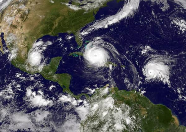 Hurricane Irma, centre, is pictured over the Caribbean, between tropical storms Katia, left, and Jose. Photograph: NASA/Getty