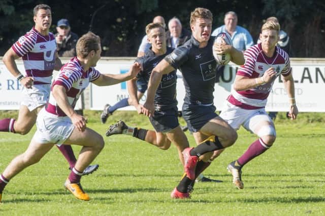 Curries Ben Robbins goes past the Watsonians defence to score the sixth and final try.  Photograph: Ian Rutherford