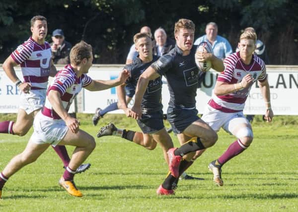Curries Ben Robbins goes past the Watsonians defence to score the sixth and final try.  Photograph: Ian Rutherford
