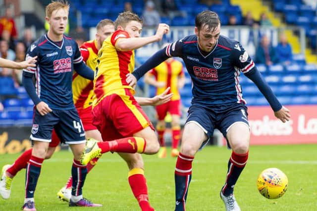 Ross County's Sean Kelly (right) gets away from Blair Spittal. Picture: SNS/Sammy Turner