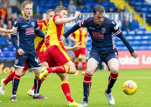 Ross County's Sean Kelly (right) gets away from Blair Spittal. Picture: SNS/Sammy Turner