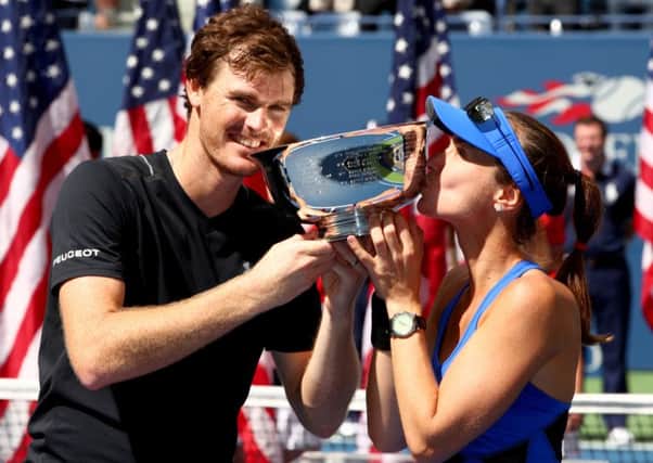 Jamie Murray of Great Britain and Martina Hingis of Switzerland pose during the trophy presentation after defeating Hao-Ching Chan of Taiwan and Michael Venus of New Zealand in their Mixed Doubles finals match. Picture: Clive Brunskill/Getty Images