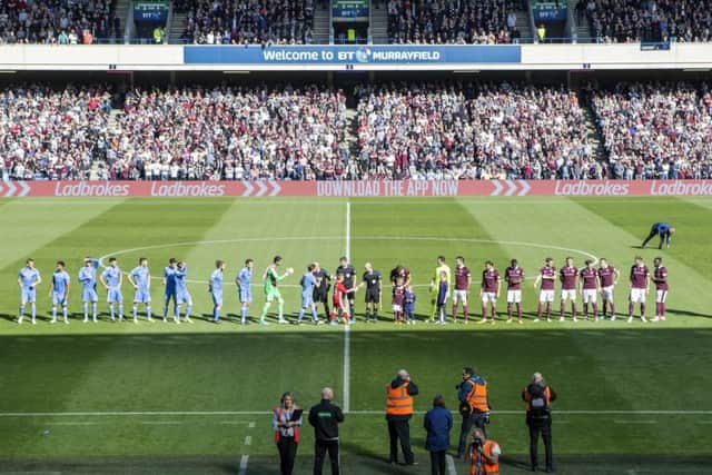 The Hearts and Aberdeen players shake hands at BT Murrayfield. Picture: SNS