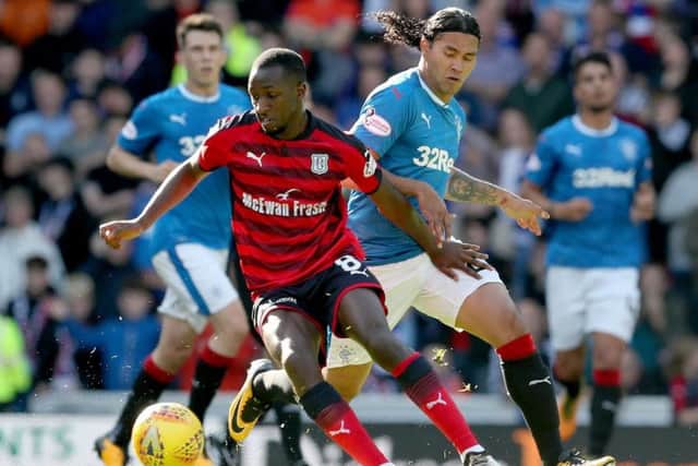 Rangers' Carlos Pena and Dundee's Glen Kamara (left) battle for the ball during the Ladbrokes Scottish Premiership match at the Ibrox Stadium, Glasgow. PRESS ASSOCIATION Photo. Picture date: Saturday September 9, 2017. See PA story SOCCER Rangers. Photo credit should read: Jane Barlow/PA Wire. RESTRICTIONS: EDITORIAL USE ONLY