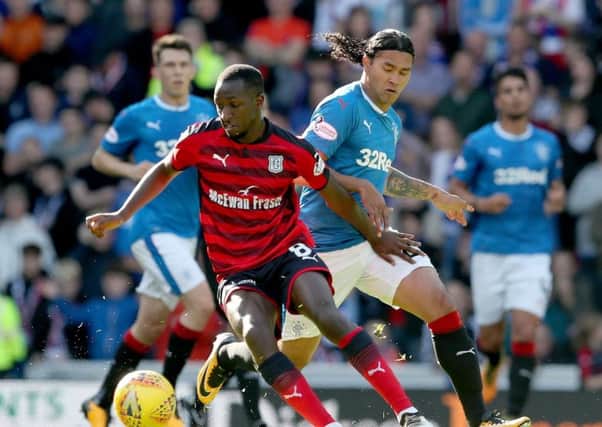 Rangers' Carlos Pena and Dundee's Glen Kamara (left) battle for the ball during the Ladbrokes Scottish Premiership match at the Ibrox Stadium, Glasgow. PRESS ASSOCIATION Photo. Picture date: Saturday September 9, 2017. See PA story SOCCER Rangers. Photo credit should read: Jane Barlow/PA Wire. RESTRICTIONS: EDITORIAL USE ONLY