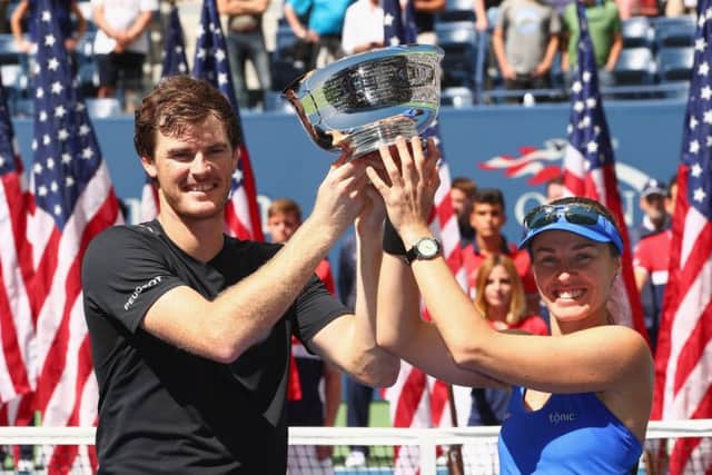 Jamie Murray and Martina Hingis enjoy the moment after winning the mixed doubles. Picture: Getty.