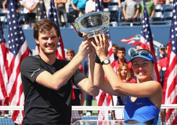 Jamie Murray and Martina Hingis enjoy the moment after winning the mixed doubles. Picture: Getty.