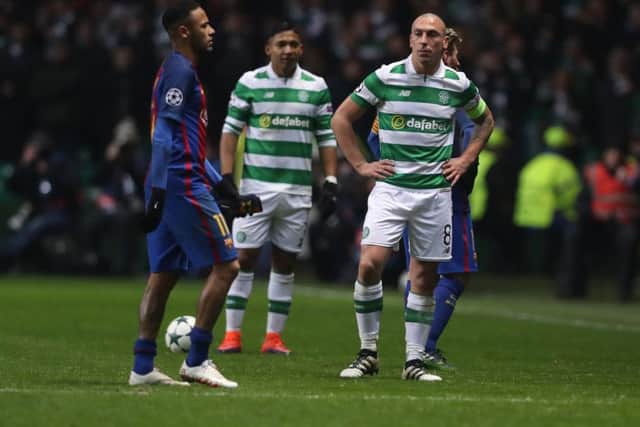 Scott Brown of Celtic looks on as Neymar of Barcelona leaves the field too boos. Picture: Ian MacNicol/Getty Images