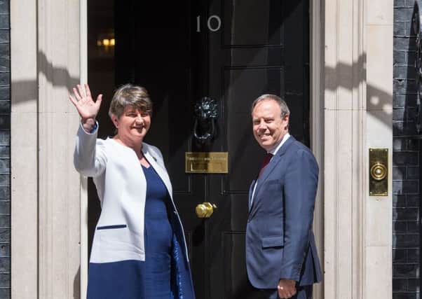DUP leader Arlene Foster and DUP deputy leader Nigel Dodds at 10 Downing Street. Picture: PA