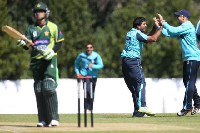 Majid Haq of Scotland celebrates bowling out Mohammad Hafeez of Pakistan during ODI in 2013. Picture: Ian MacNicol/AFP/Getty Images
