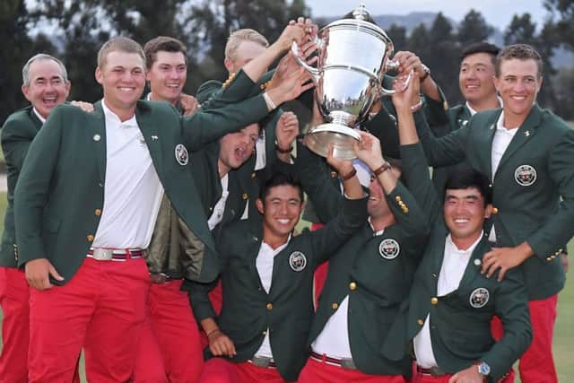 The United States team poses with the Walker Cup trophy after defeating Great Britain and Ireland. Picture: Mark J. Terrill/AP