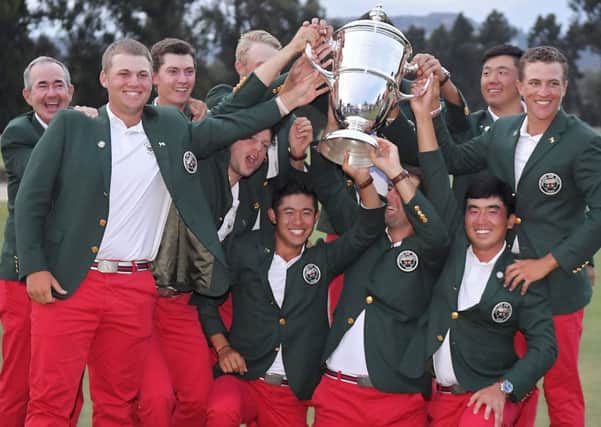 The United States team poses with the Walker Cup trophy after defeating Great Britain and Ireland. Picture: Mark J. Terrill/AP