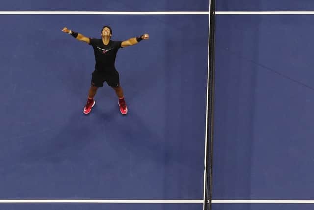 Rafael Nadal in triumphant pose after his win over Anderson, below. Right, Nadal with the US Open trophy. Picture: AP
