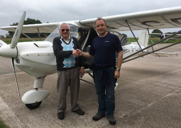 David Luke with his flying instructor Graham McNally at Strathaven Airfield in South Lanarkshire. Picture: Centre Press