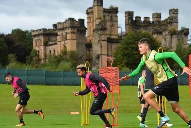 Tom Rogic, left, Scott Sinclair, centre, and Mikael Lustig take part in training at Lennoxtown yesterday as Celtic prepared to face Paris Saint Germain. Picture Mark Runnacles/Getty