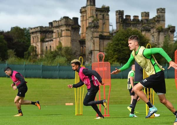 Tom Rogic, left, Scott Sinclair, centre, and Mikael Lustig take part in training at Lennoxtown yesterday as Celtic prepared to face Paris Saint Germain. Picture Mark Runnacles/Getty