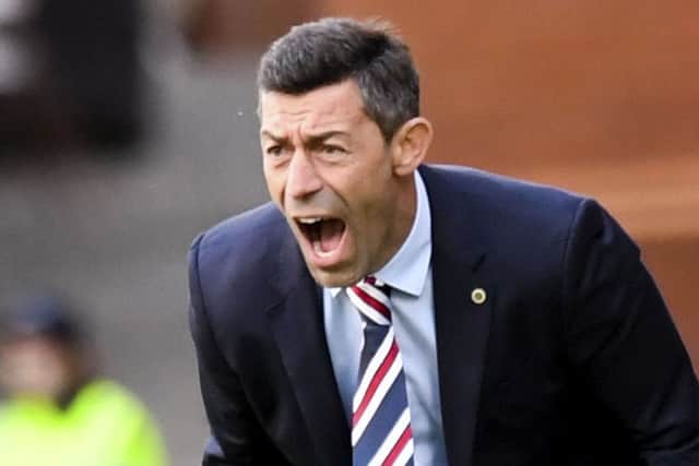 Pedro Caixinha is pleased to see his Rangers players celebrating together. Picture: SNS
