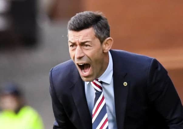 Pedro Caixinha is pleased to see his Rangers players celebrating together. Picture: SNS