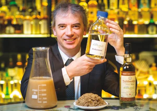 Prof Martin Tangney, founder of Celtic Renewables showing the first sample of bio-butanol at The Scotch Whisky Experience, Edinburgh.