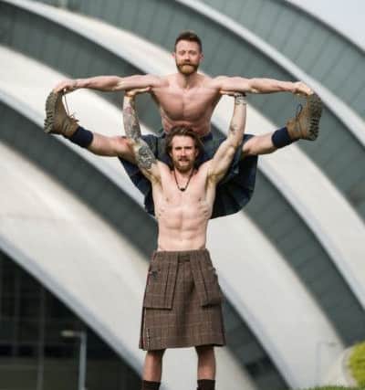 Finlay Wilson and Tristan Cameron-Harper, whose video of them practising yoga in traditional Scottish attire was viewed more than 50 million times. Picture: John Devlin
