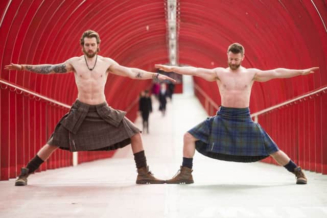 Finlay Wilson and Tristan Cameron-Harper, whose video of them practising yoga in traditional Scottish attire was viewed more than 50 million times. Picture: John Devlin
