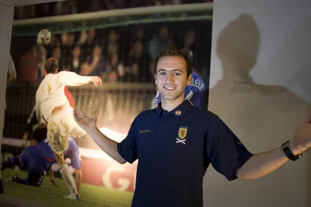 James McFadden with a picture of his match winning strike against France inside Hampden Park. Picture: SNS