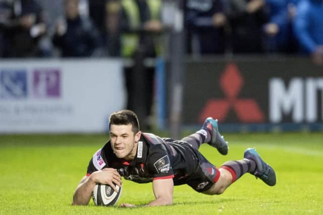 Edinburgh full-back Blair Kinghorn dives over to score the first try of the night against the Dragons on Friday. Picture: Bill Murray/SNS