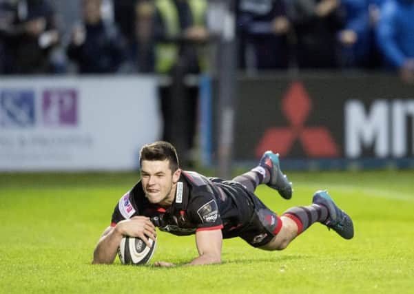 Edinburgh full-back Blair Kinghorn dives over to score the first try of the night against the Dragons on Friday. Picture: Bill Murray/SNS
