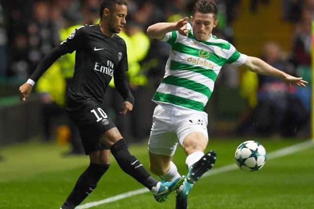 Celtic defender Anthony Ralston challenges PSG striker Neymar at Parkhead.