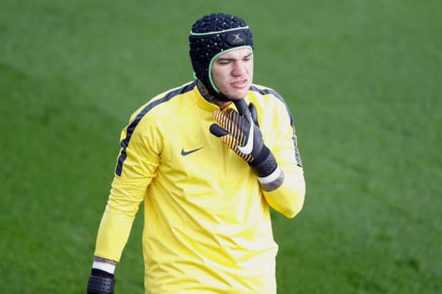 Manchester City goalkeeper Ederson wears a protective helmet during training yesterday and will be assessed today. Picture: PA.