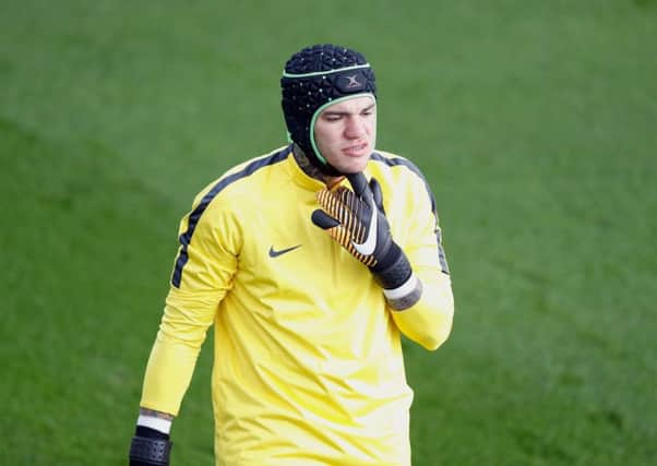 Manchester City goalkeeper Ederson wears a protective helmet during training yesterday and will be assessed today. Picture: PA.