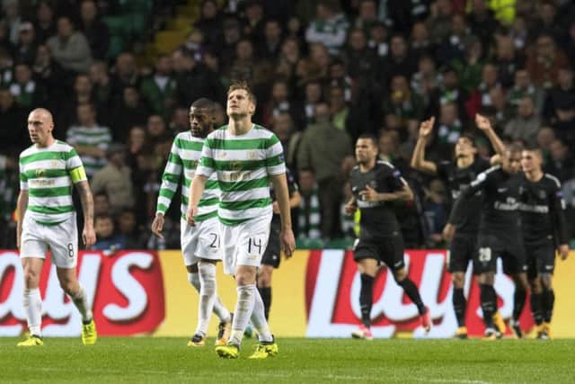 Dejection for Celtic as PSG celebrate going 3-0 up. Picture: SNS