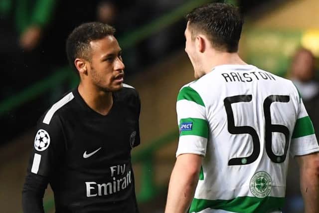 Anthony Ralston, right, and Neymar squaring up to each other during the match. Picture: SNS