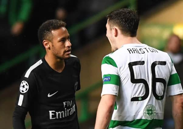 Anthony Ralston, right, and Neymar squaring up to each other during the match. Picture: SNS
