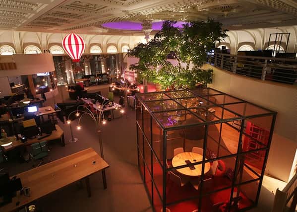 Itison's new Glasgow HQ features a hot air balloon, a large tree and a fireman's pole. Picture: Fraser Jarvis