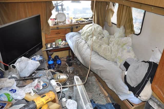 Undated handout file photo issued by Lincolnshire Police of a caravan which men were forced to live in by the Rooney