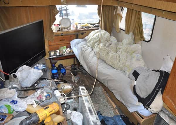 Undated handout file photo issued by Lincolnshire Police of a caravan which men were forced to live in by the Rooney