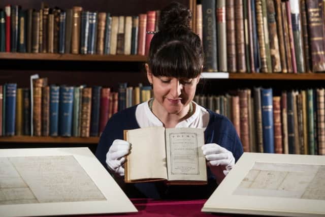 Claire McGugan, principal Librarian of Special Collections at Mitchell Library, with some of the rare autographed Robert Burns manuscripts  to go on show this weekend. PIC: John Devlin/TSPL.
