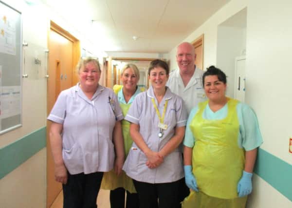 Hilary Ford (centre) on her day as a Healthcare Assistant with staff at the Marie Curie Hospice, Edinburgh