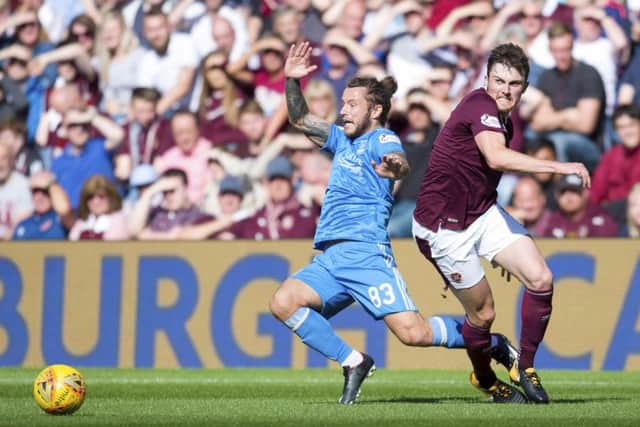 Hearts' John Souttar, right, competes with Aberdeen's Stevie May at BT Murrayfield. Picture: Rob Casey/SNS