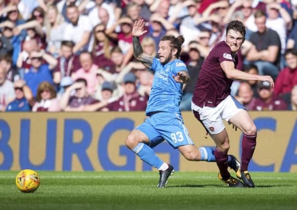 Hearts' John Souttar, right, competes with Aberdeen's Stevie May at BT Murrayfield. Picture: Rob Casey/SNS