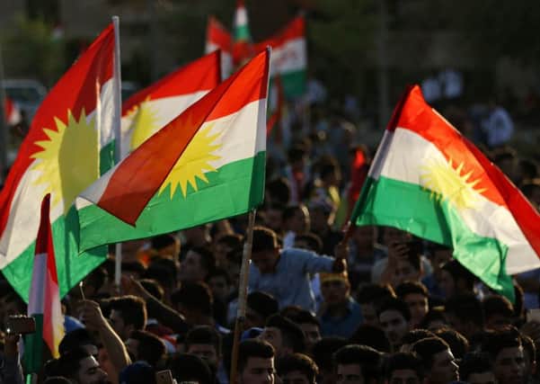Iraqi Kurds gather in Arbil, the capital of the Kurdish region, flying Kurdish flags as they urge people to vote in the upcoming independence referendum. Picture: SAFIN HAMED/AFP/Getty Images