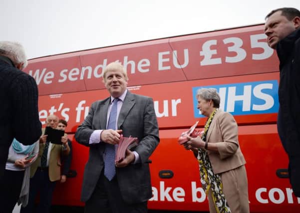 Boris Johnson prepares to board the Vote Leave campaign bus, complete with the slogan claiming Brexit would boost NHS coffers by Â£350m a week. Picture: PA