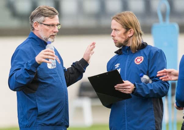Hearts manager Craig Levein, left, discusses strategy with assistant Austin MacPhee. Picture: SNS.