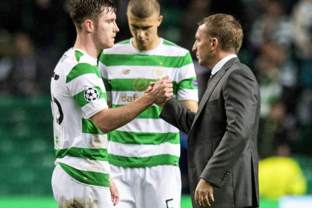 Brendan Rodgers, right, insists Celtic's belief won't be punctured by their 5-0 defeat by PSG. Picture: SNS