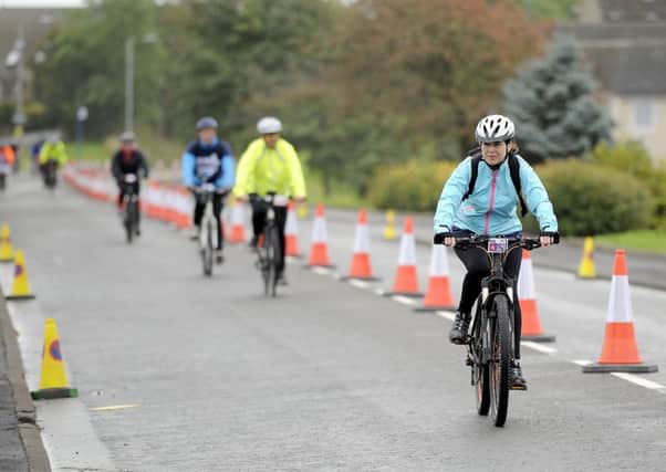Pedal for Scotland riders in coned-off Maddiston, near Linlithgow, on Sunday. Picture Michael Gillen