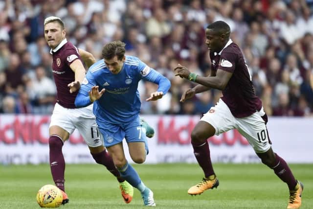 Aberdeen's Kenny McLean, centre, in action against Hearts. He is out of contract at the end of the season. Picture: Rob Casey/SNS