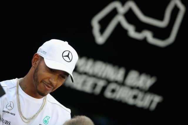 Lewis Hamilton talks to the media in the Paddock ahead of the Singapore GP. Picture: Clive Mason/Getty Images