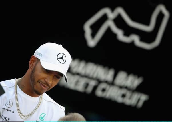 Lewis Hamilton talks to the media in the Paddock ahead of the Singapore GP. Picture: Clive Mason/Getty Images