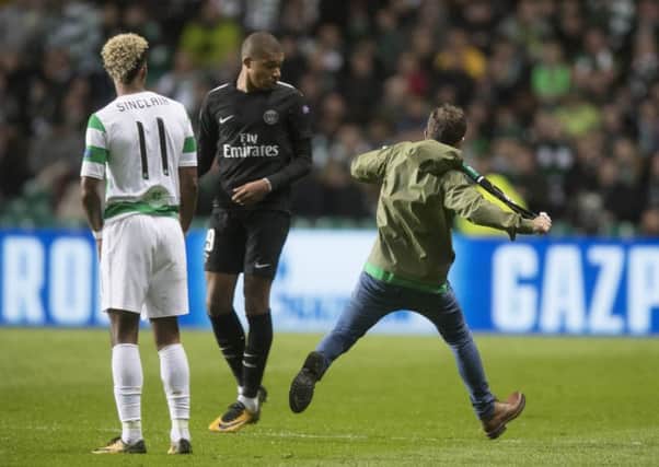 The Celtic fan aimed a kick at Kylian Mbappe of Paris Saint Germain. Picture: Getty